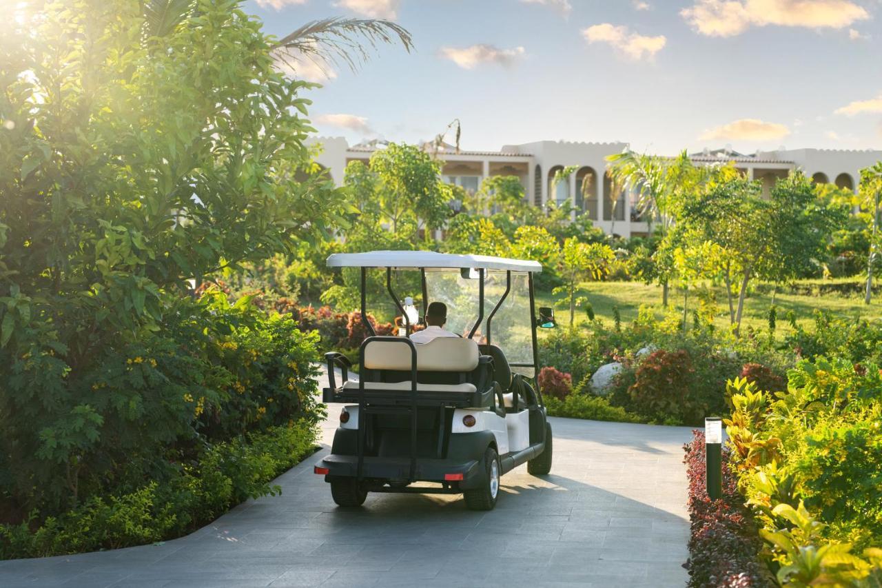 The Mora Zanzibar Hotel Matemwe  Bagian luar foto Golf cart at the Four Seasons Resort