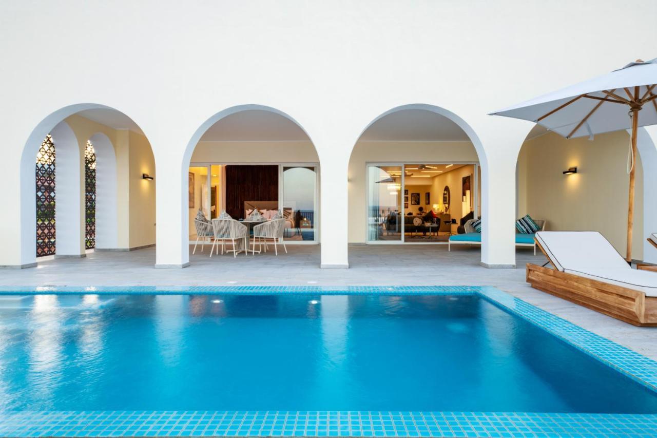 The Mora Zanzibar Hotel Matemwe  Bagian luar foto A pool at the hotel