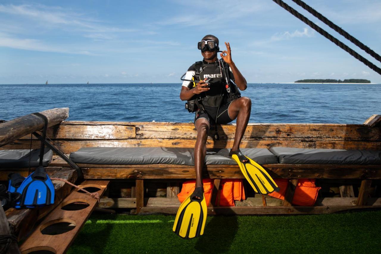The Mora Zanzibar Hotel Matemwe  Bagian luar foto Scuba diver with a pair of open heel fins